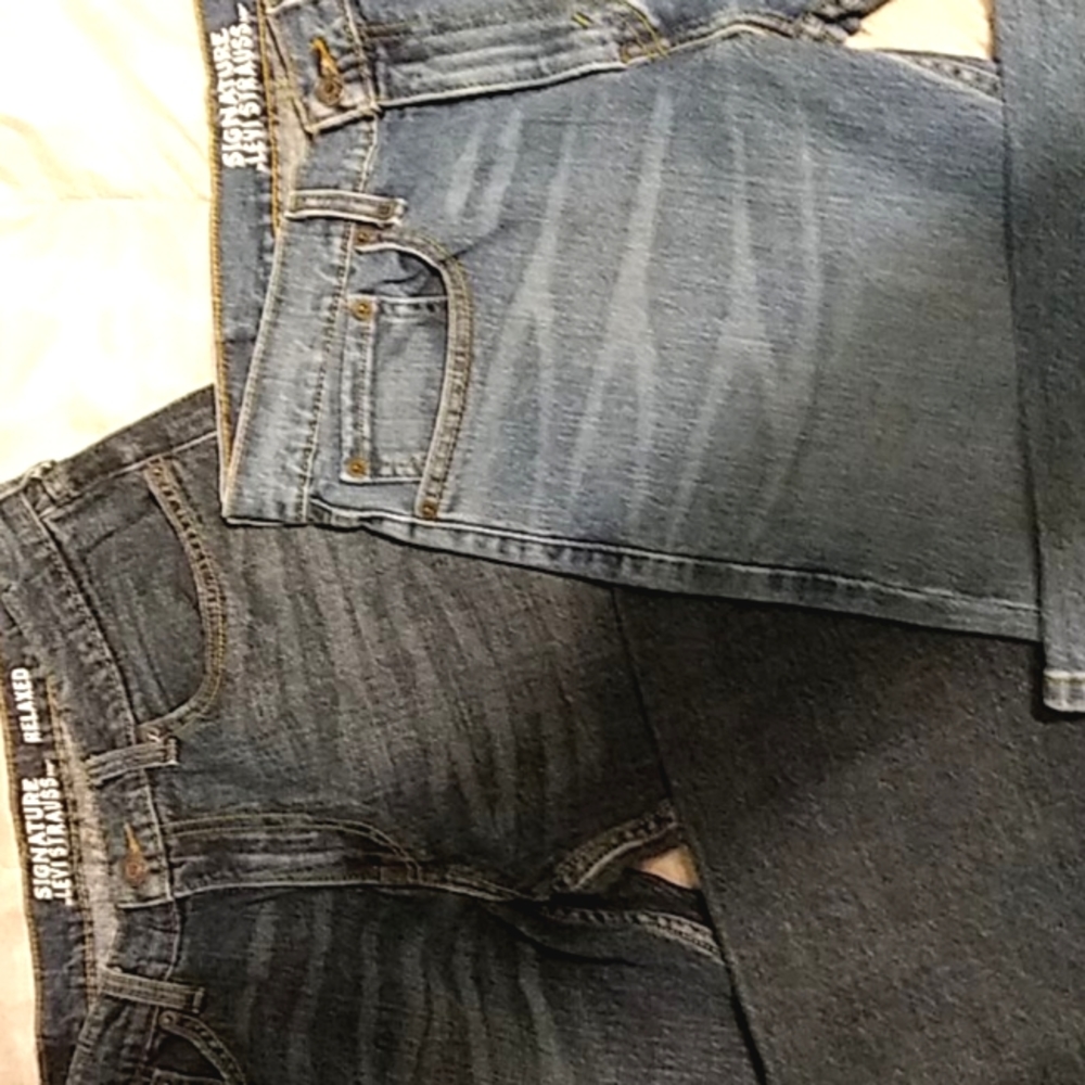 Two pair of Levi's signature relaxed jeans.